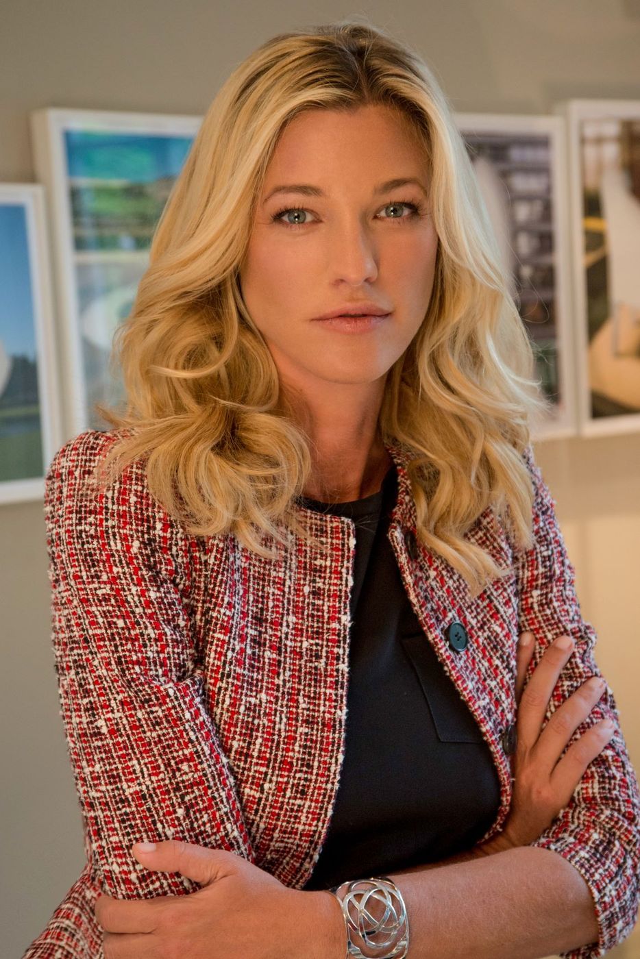 Nicole Junkermann in a textured tweed jacket, a bright editorial portrait in a light-filled room